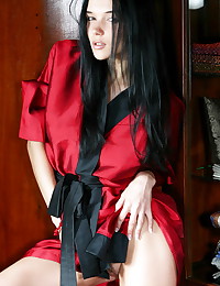 Her red satin robe is sexy an...