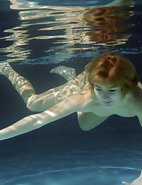 This amazing artistic gallery shows a girl posing underwater.
