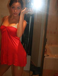 Hot big-tittied brunette chick self-shooting in front of a mirror