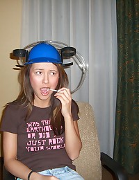 Baileys Room - Barely legal young slut trying on her beer helmet